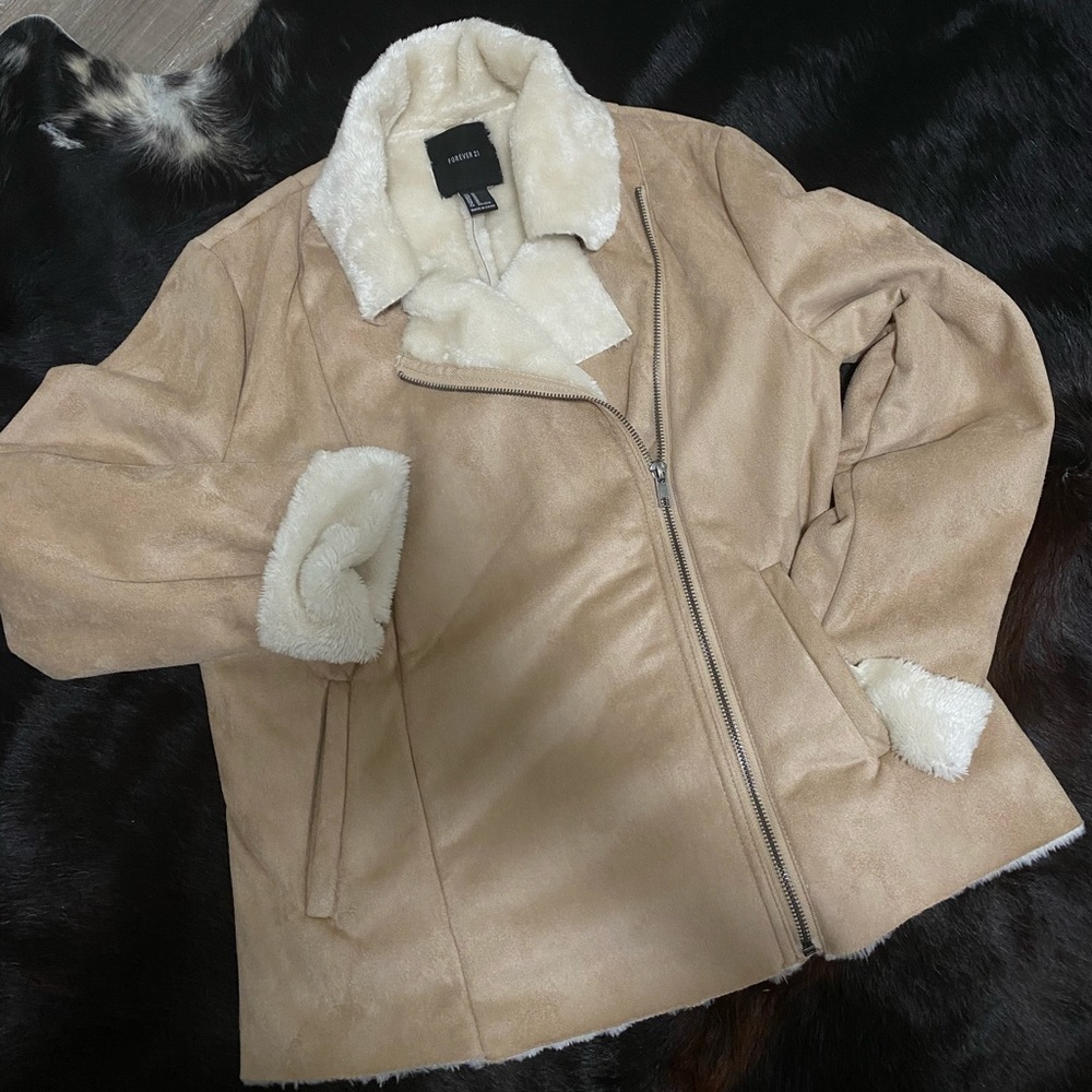 Warm light brown zip up jacket with cream white velvet interior. Light weight